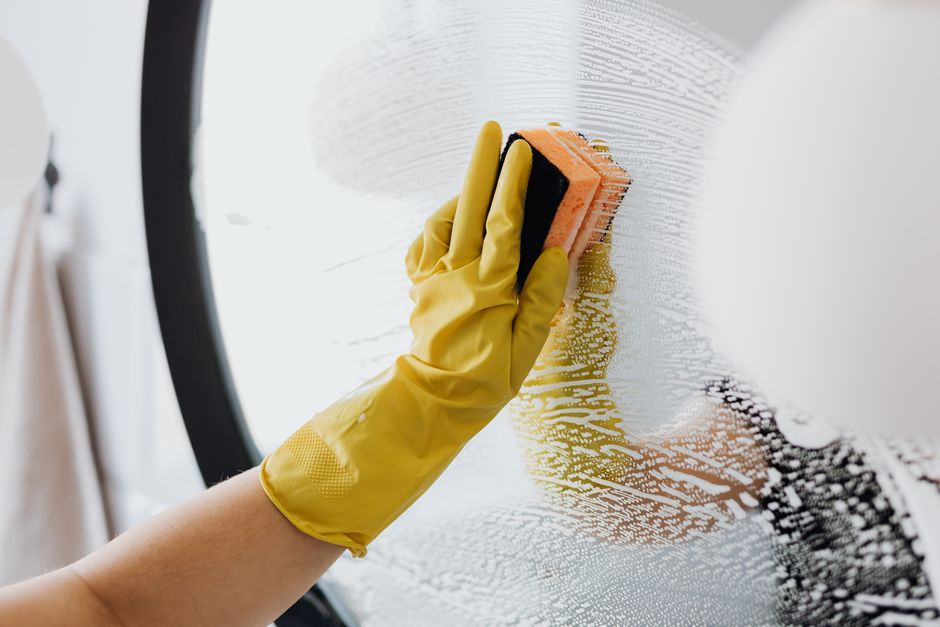 Cleaning a bathroom mirror